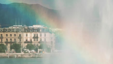 rainbow under the water jet in geneva, lac leman, switzerland