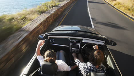 Couple-driving-convertible-car-cabriolet-cape-town-south-africa-steadicam-shot