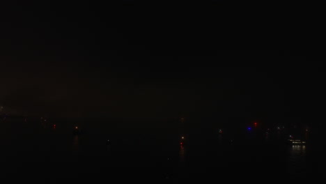 fireworks flash light in the sky on the fourth of july as seen from a drone