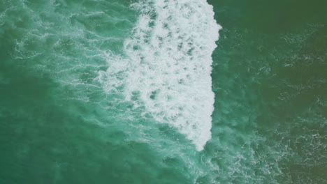 white ocean foam texture top shot. sea water surface rippling foaming