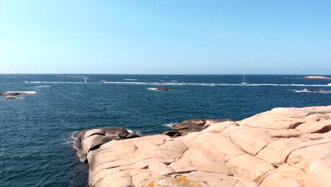 aerial shot of a boat race with yachts and speedboats on the coast of sweden