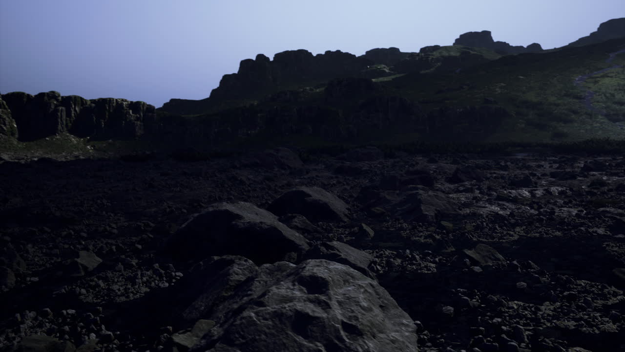 Exploring rocky terrain under a twilight sky in a remote mountain area