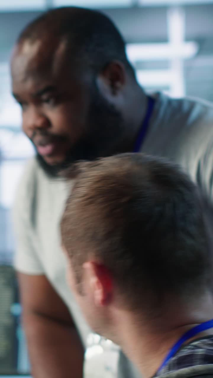 IT Professionals Collaborating and Discussing Data in a Modern Office