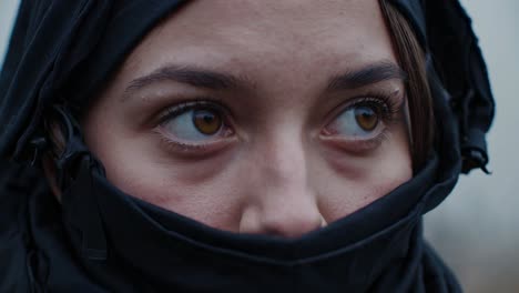 military personnel wearing protective balaclava, showcasing intense concentration during high stress tactical operation, revealing resilient warrior expression