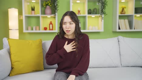 asian young woman suffering from shortness of breath.