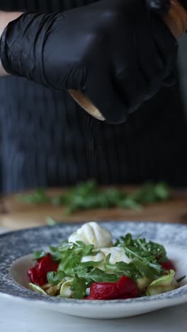 chef preparing a burrata salad