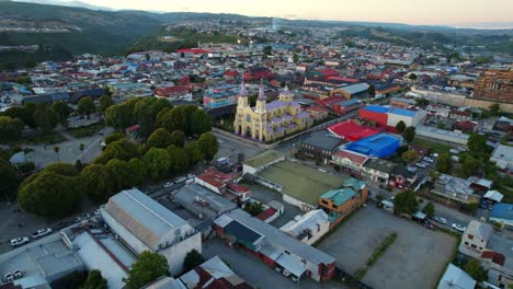 Drone-flying-toward-Majestic-San-Francisco-de-Castro-Church,-Unesco-Heriatage-site,-Castro