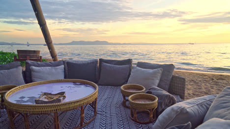 pillows-on-outdoor-patio-deck-chair-on-beach-with-sunset-times-background