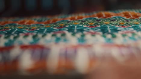 close up macro shot of a colorful guatemalan handmade textile