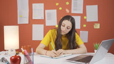 Studying-girl-child-is-finishing-her-homework.