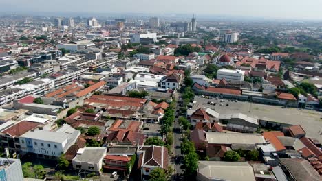 city streets and buildings of semarang, aerial drone view