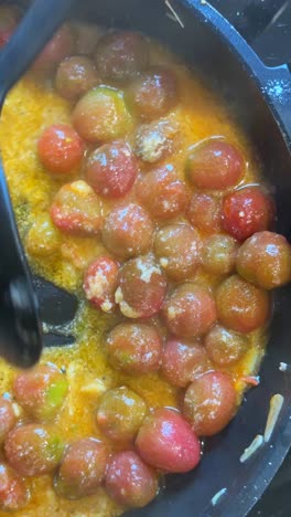 cooking tomatoes in a pan