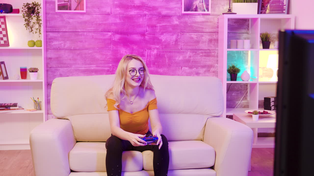 Woman playing videogames on console