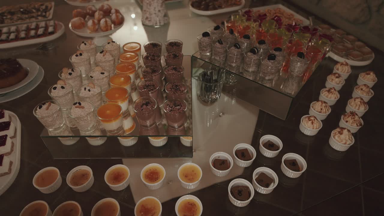 Variety of desserts including mousse and cakes at buffet table