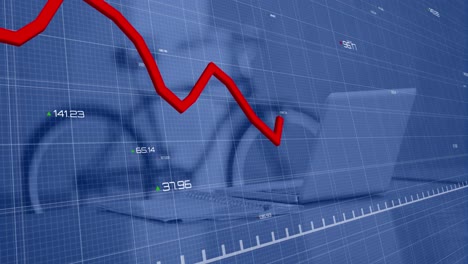 data processing and red line graph over computer on desk and bicycle