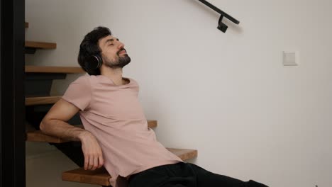 enjoying listening to music while sitting on the stairs