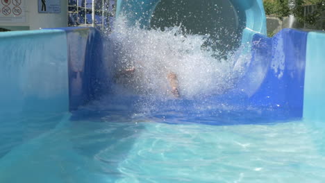 woman going down water slide