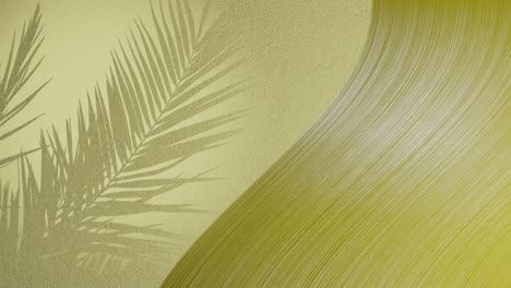 palm leaves shadow on yellow background wall with copy space