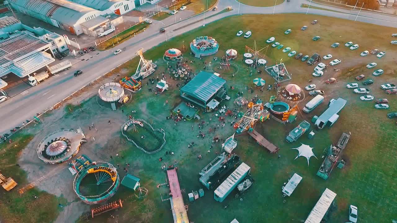 Aerial drone footage of a small town carnival at the sunset