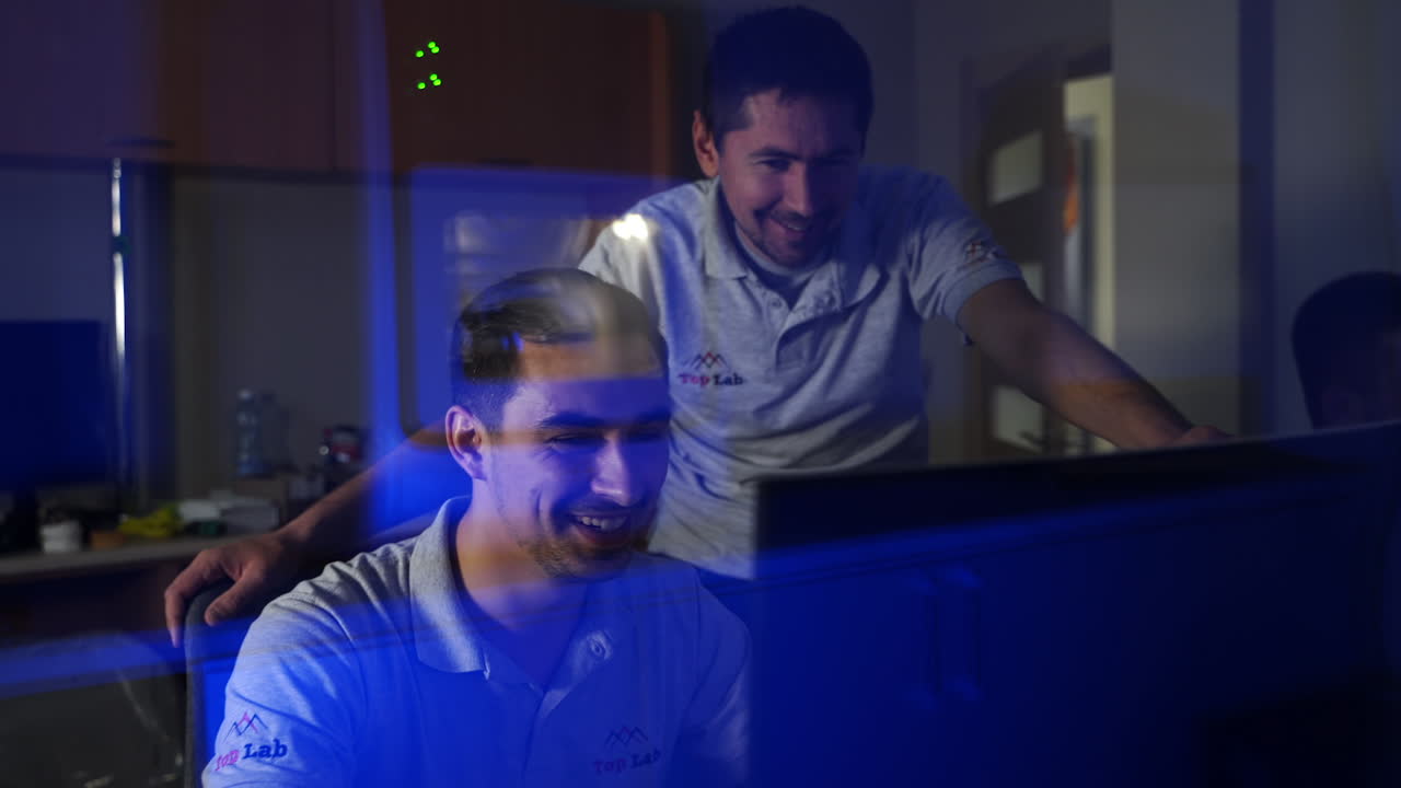 Dental technician working in lab. Male dental technician making tooth implants in lab