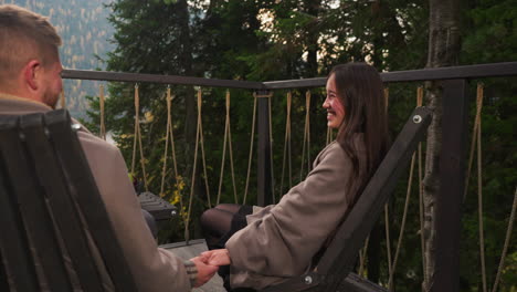 a couple enjoying a romantic view from a balcony