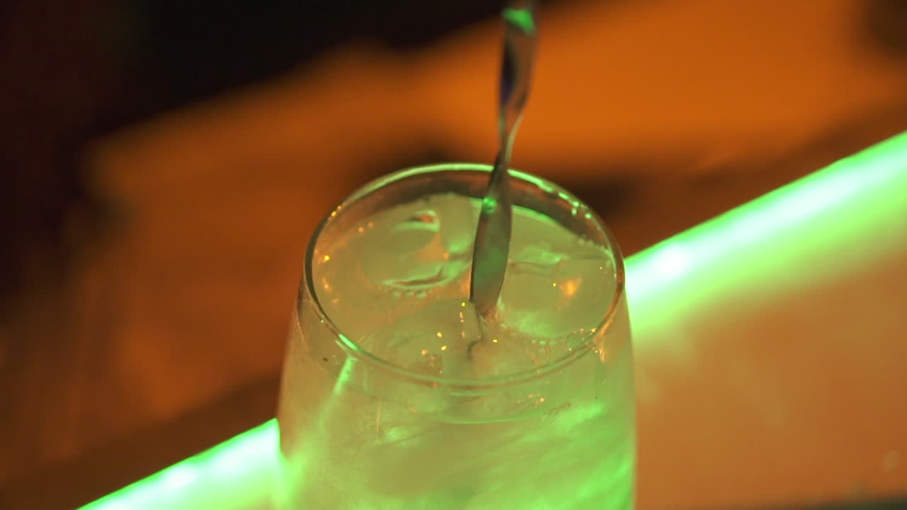 Premium cocktail glass glowing at night, fine dining and mixology luxury style