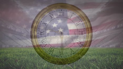 Animation-of-clock-and-flag-of-america-over-low-angle-view-of-grass-and-empty-stadium