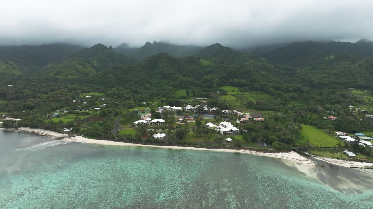 Aerial establishing pullback from abandoned hotel in Rarotonga Cook Islands