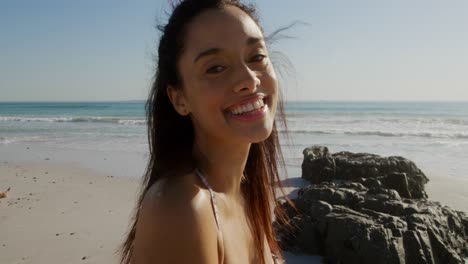 young woman by the sea