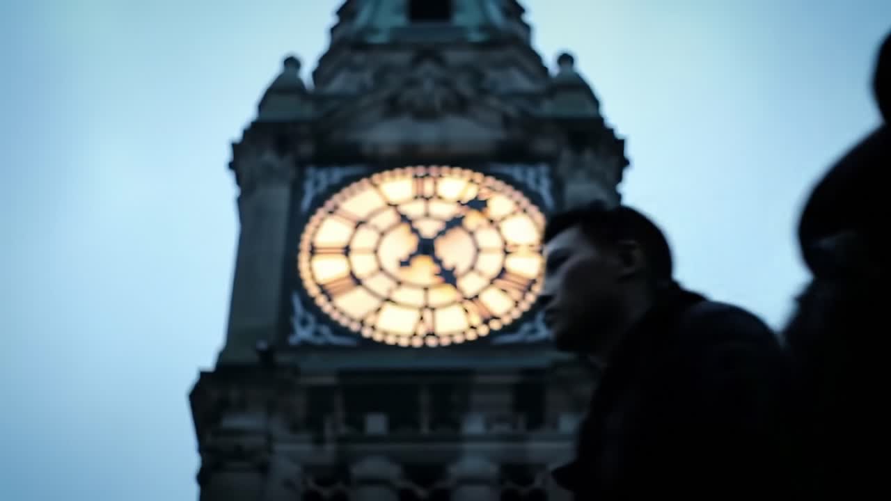 A Majestic Clock Tower Illuminated Against the Evening Sky, Capturing the Essence of Timeless Architecture in a Light-Filled Moment of Serenity and Reflection