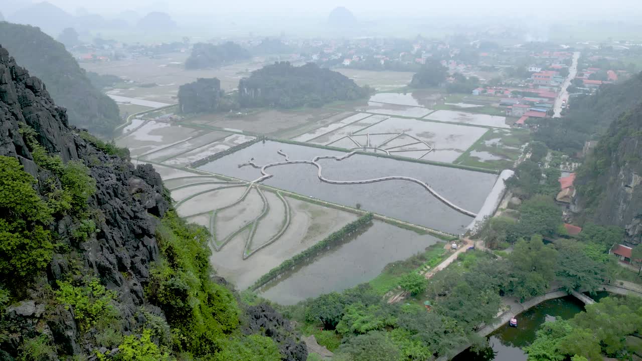 Tam Coc Rice Fields On A Foggy Day From Hang Mua Viewpoint In Ninh Binh, Vietnam. - ascend shot