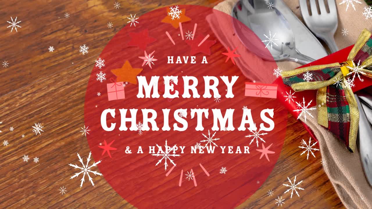 테이블 위 에 있는 식구 위 에 있는 메리 크리스마스 텍스트 의 애니메이션