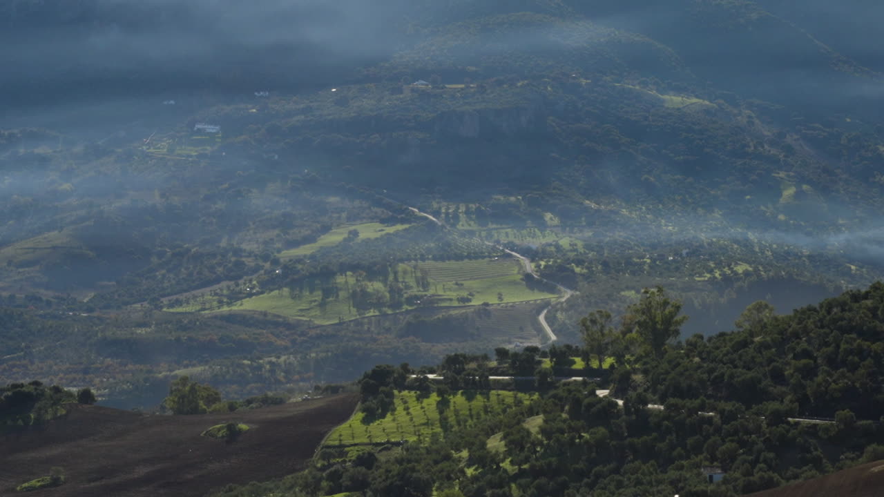 Beautiful green and misty valley of Spain, aerial view
