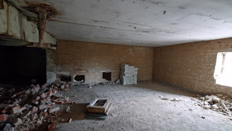 broken wall and a pile of old bricks in the spacious room of an old building. reconstruction of a house.