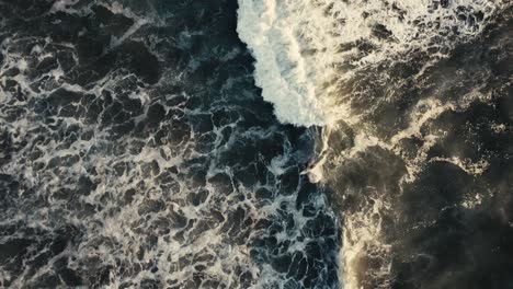 skilled-surfer-riding-a-perfect-wave-during-sunset-in-costa-Rica-from-above