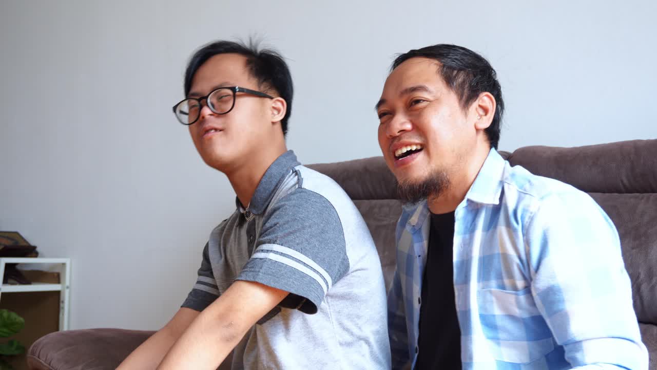 Uplifting moment as young man with Down syndrome shares an enthusiastic point of view with father