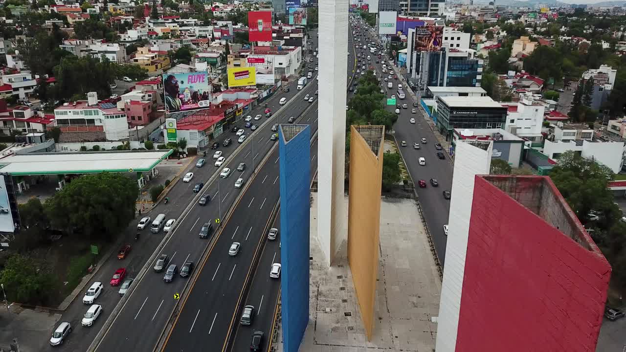 Aerial view of the Torres de Satelite and a busy highway in Mexico City