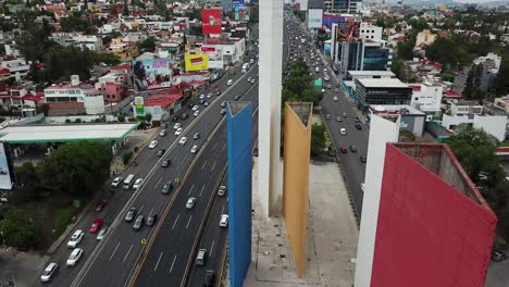 aerial view of the torres de satelite and a busy highway in mexico city