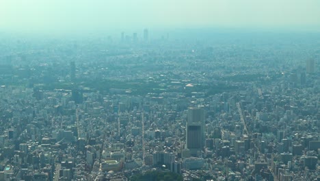 zoom out, aerial view of tokyo with skylines from skytree tower