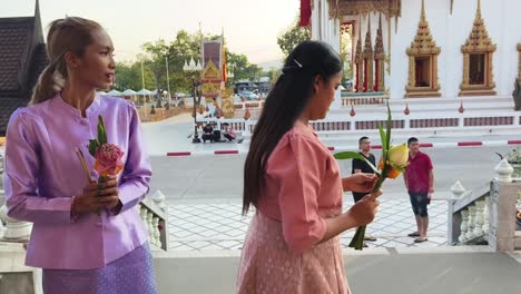 people praying at a thai temple