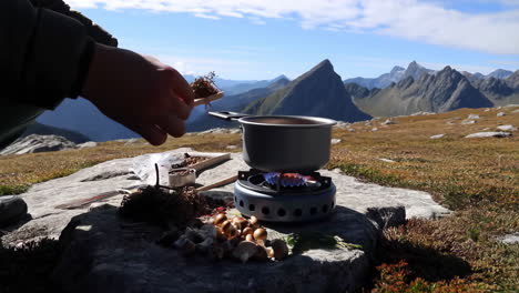 outdoor cooking in the mountains with a portable stove
