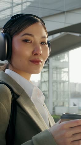 business woman with headphones and coffee