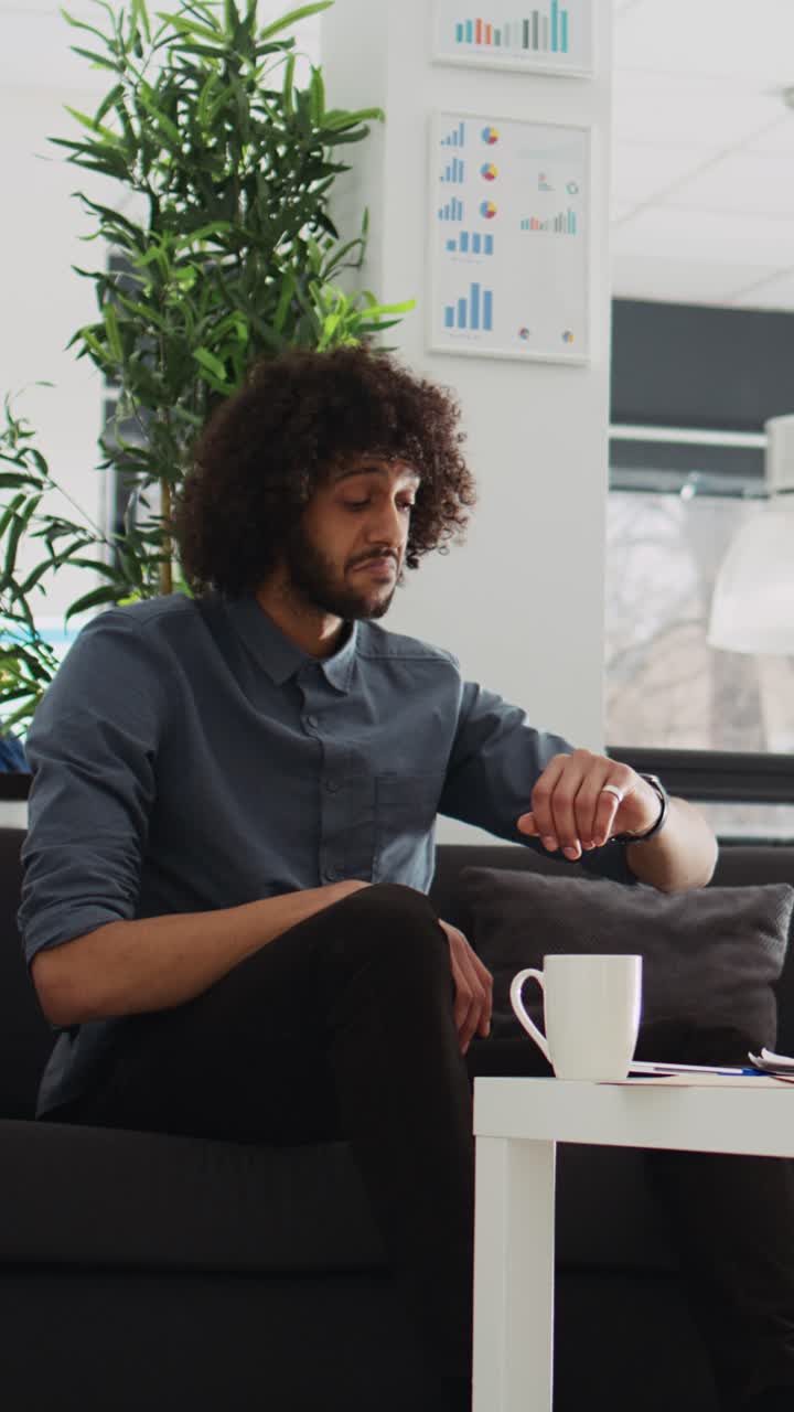 Vertical Video Employee using smartwatch for videocall