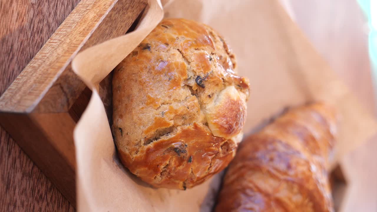 Breakfast pastries on a wooden tray