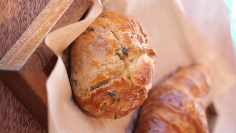 breakfast pastries on a wooden tray