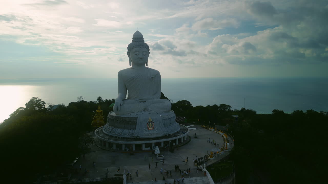 Giant Buddha Statue on Hilltop with Ocean View