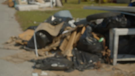 hurricane debris sits on the street waiting to be picked up. cortez, florida