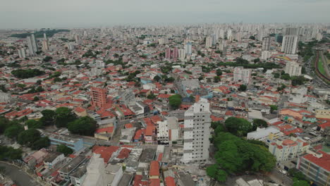 aerial view of a dense cityscape with residential and commercial buildings