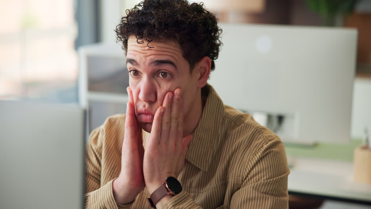 Tired Young Man Rubbing Eyes and Temples from Computer Eye Strain