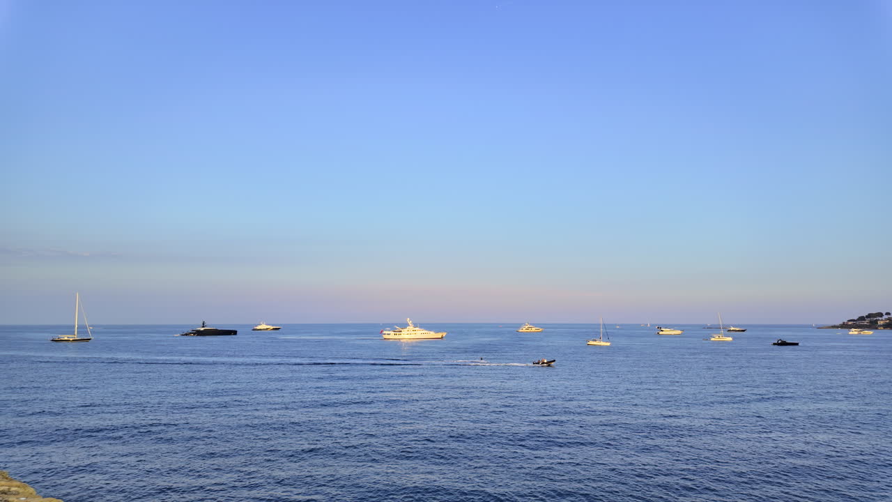 Multiple boats moving on the sea in daylight in Antibes, France